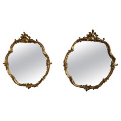 Pair of French Louis XV Style Carved 
Gilded Rounded Mirrors, 19th Century