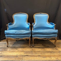 Pair of French Louis XV Style Carved Azure Blue Upholstered Armchairs
