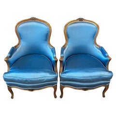 Pair of French Louis XV Style Carved Azure Blue Upholstered Armchairs