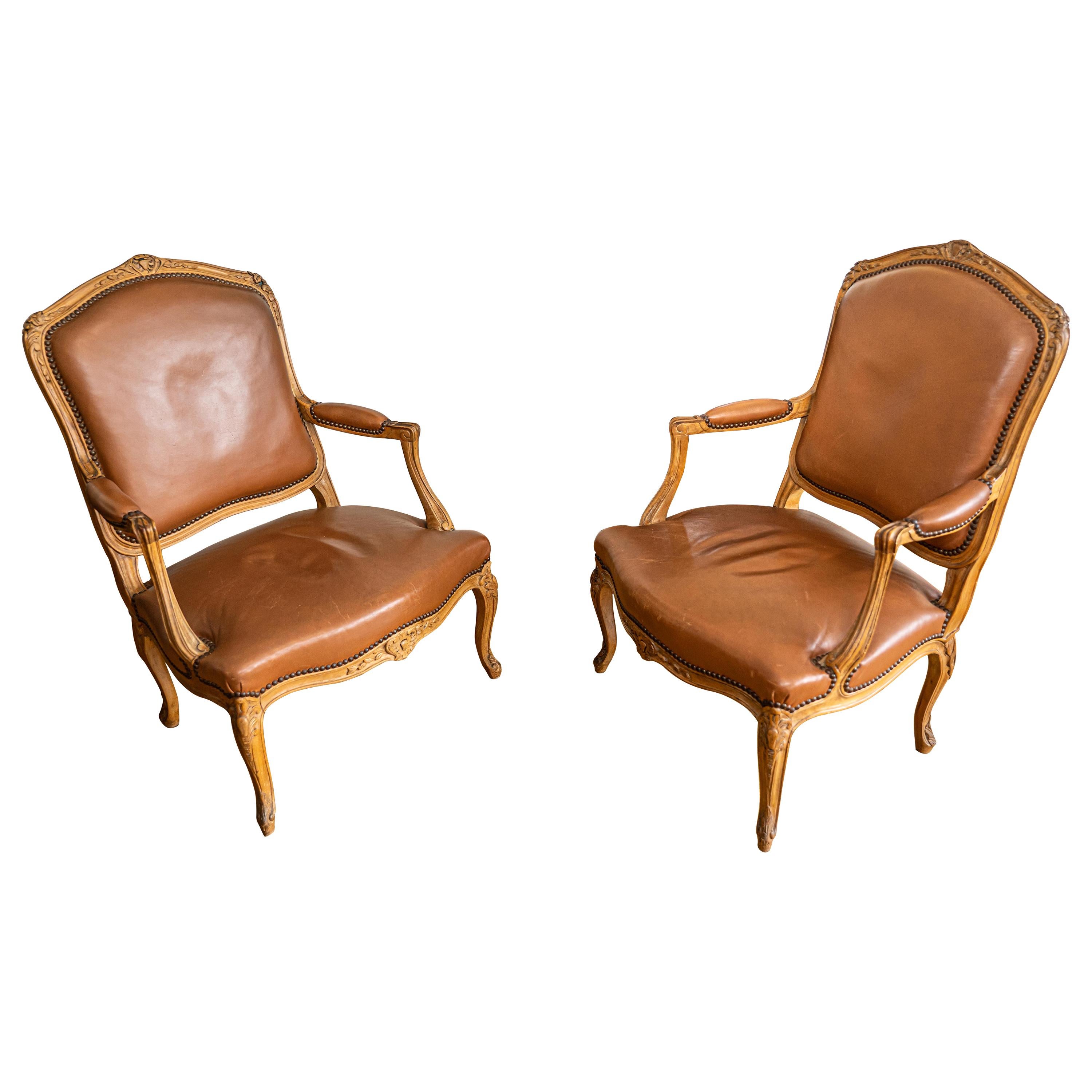 Pair of French Louis XV Style Carved Oakwood and Leather Armchairs