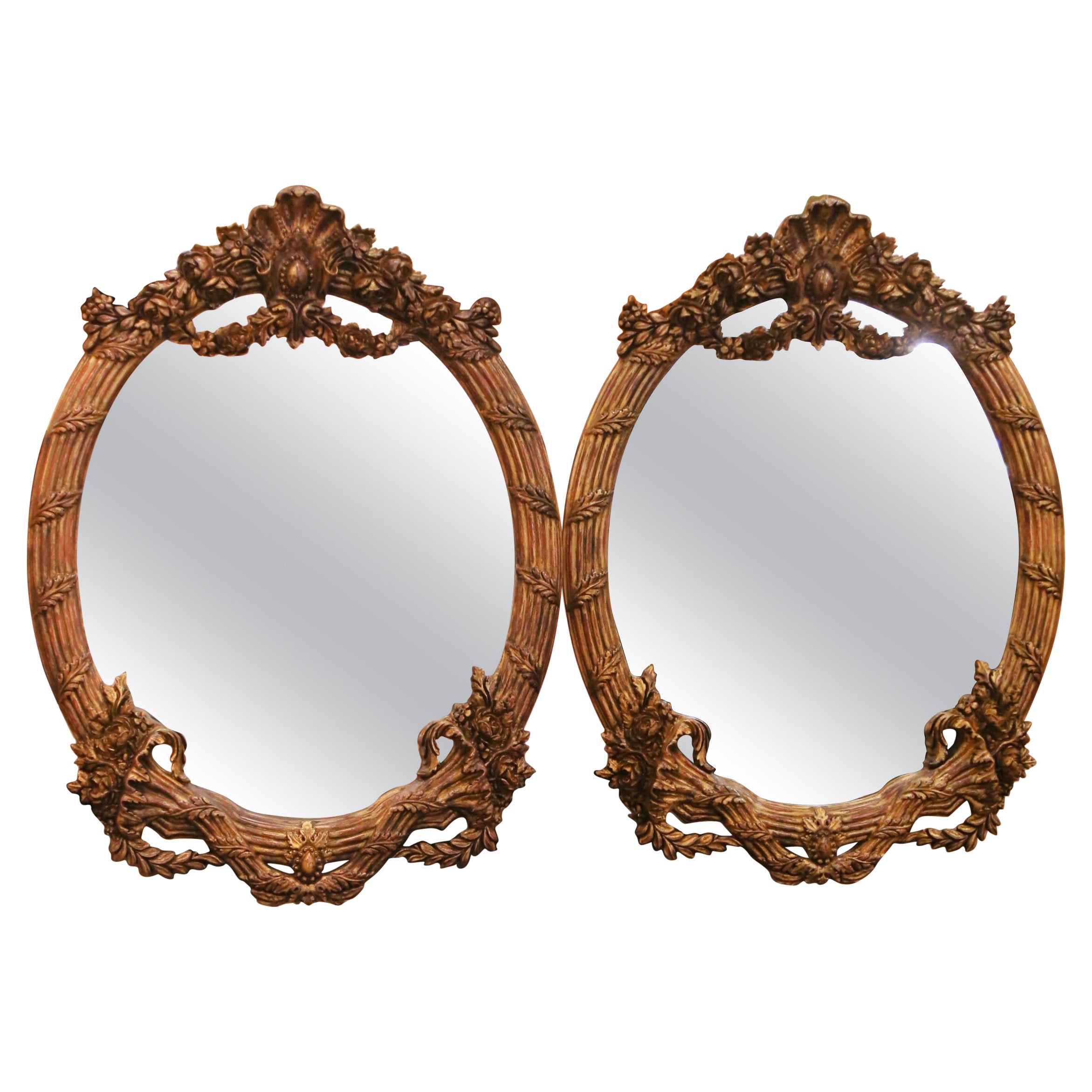 Pair of French Louis XV Style Carved Patinated Giltwood Oval Wall Mirrors
