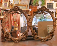 Pair of French Louis XV Style Carved Patinated Giltwood Oval Wall Mirrors