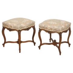 Pair of French Louis XV–Style Carved Walnut Stools