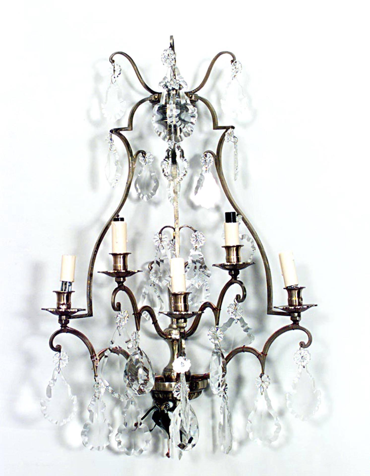 Pair of French Louis XV-style (20th Century) lacquered brass wall sconces with five arms and cut glass teardrop-shaped hanging crystals. (PRICED AS Pair)
