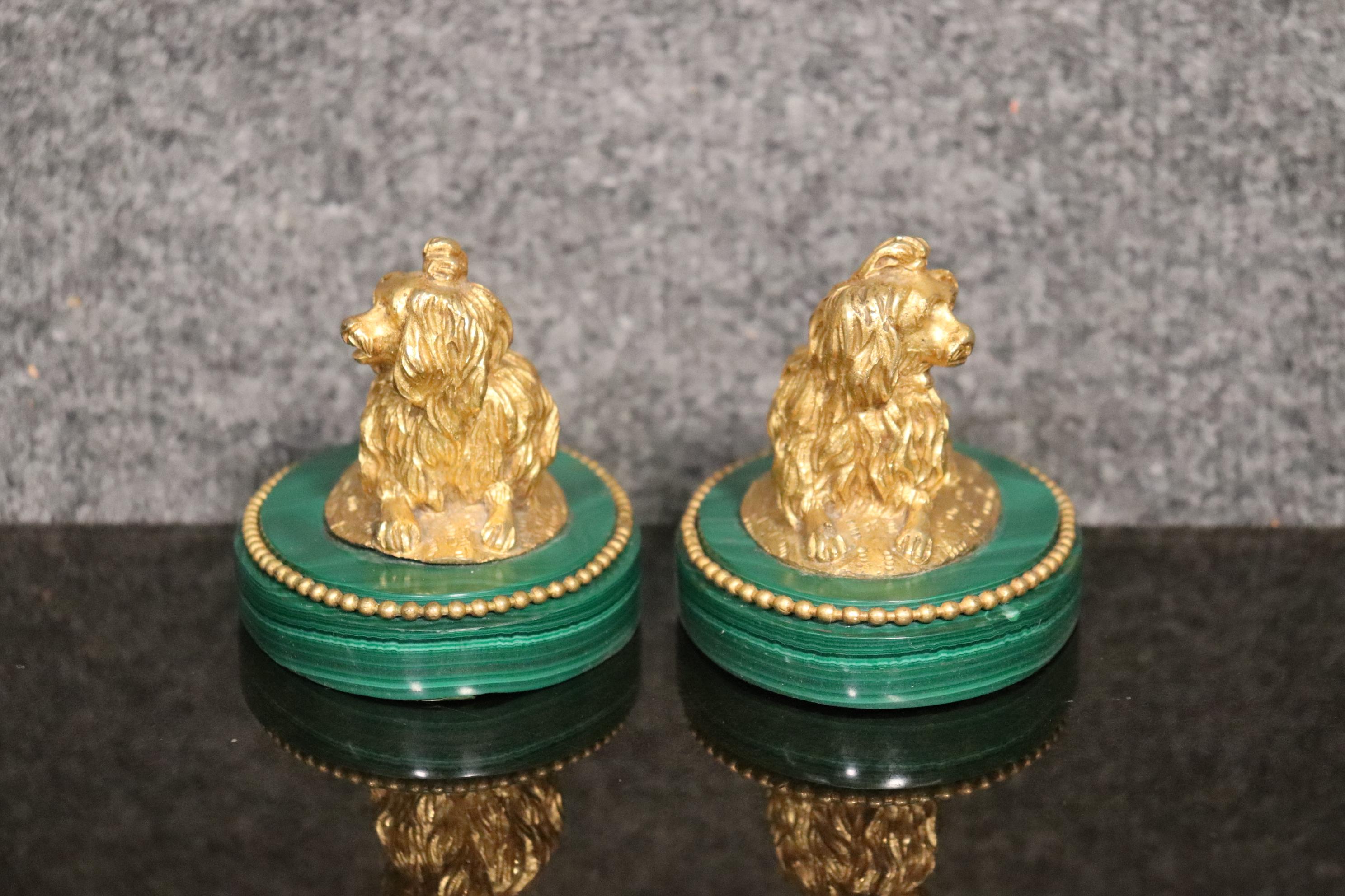 Dimensions- H: 3in W: 4 1/4in D: 2 7/8in
This exceptional pair of French Doré bronze dogs on malachite plinths/bases are an amazing example of high quality antique smalls. Finding a pair in this good of condition is highly uncommon. Malachite Was