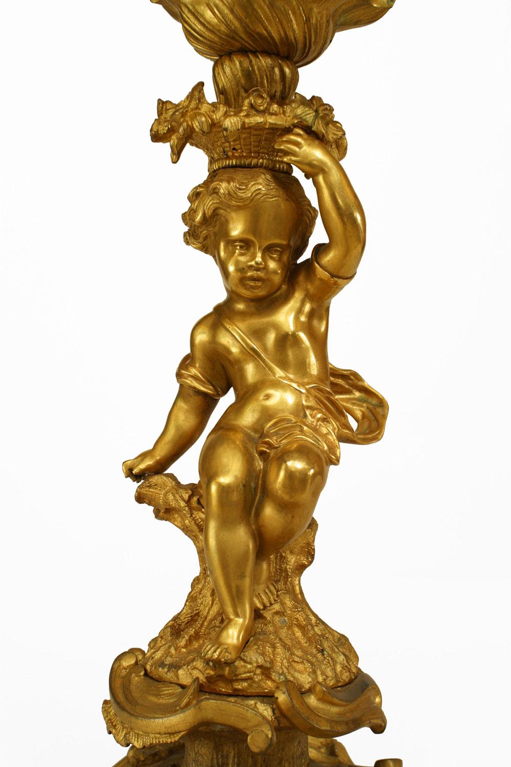 Français Pair of French Louis XV Style Gilt Bronze Cupid Candelabras en vente