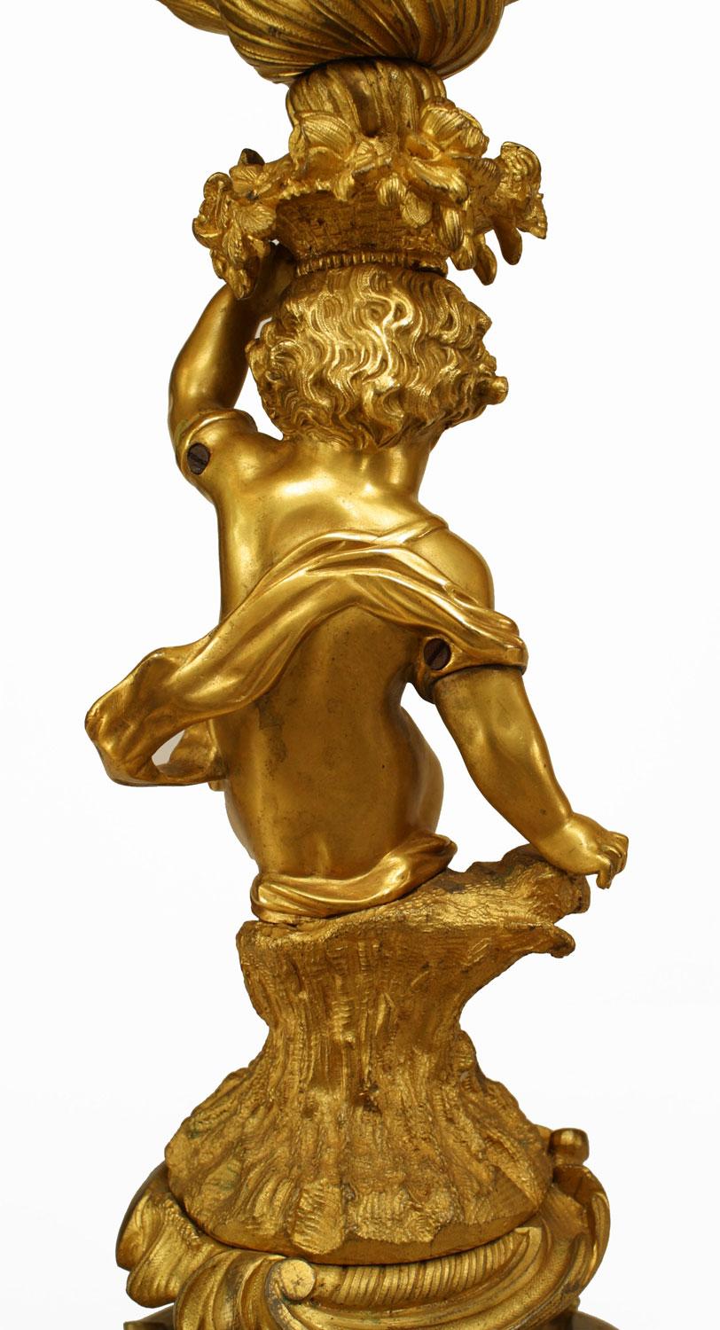 Doré Pair of French Louis XV Style Gilt Bronze Cupid Candelabras en vente