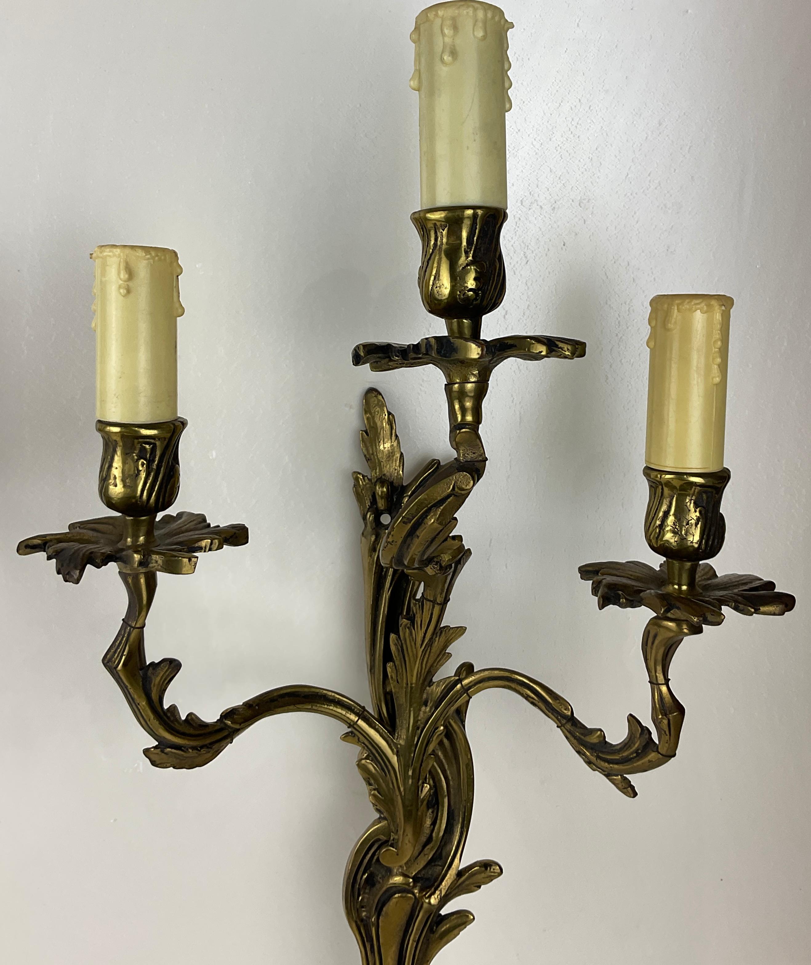 Pair of French Louis XV Style Gilt Bronze Three-Armed Sconces In Good Condition For Sale In Miami, FL