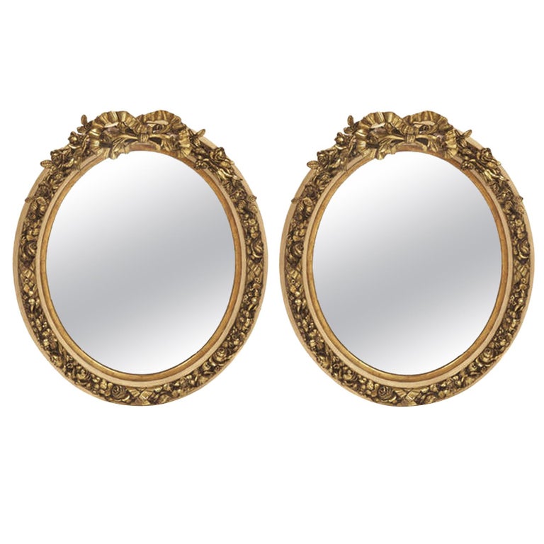 Pair of French Louis XV Style Gilt Oval Mirrors For Sale