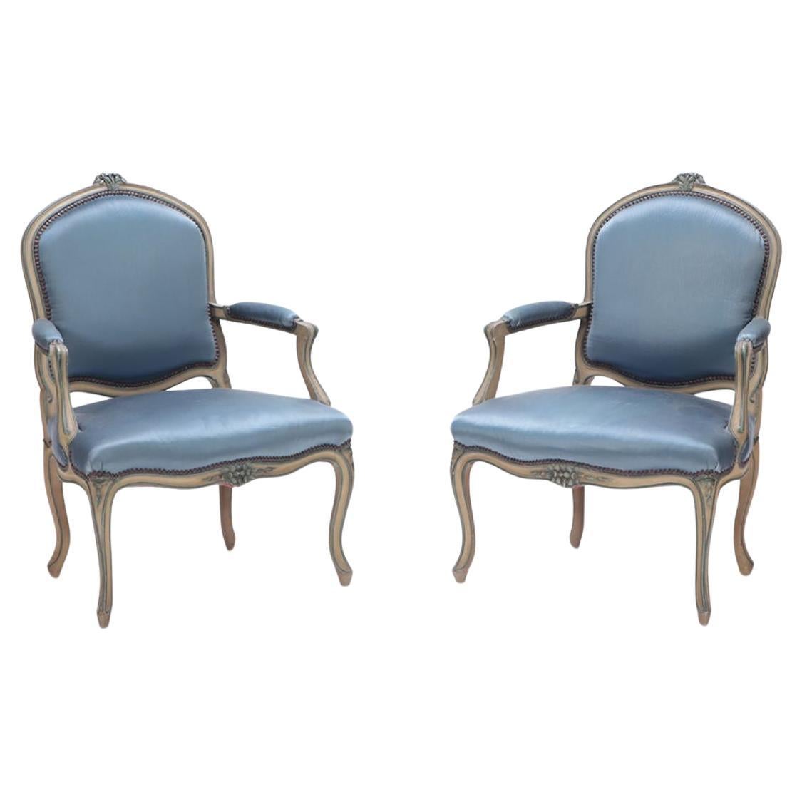 Pair of French Louis XV style open armchairs having carved frames circa 1920. For Sale