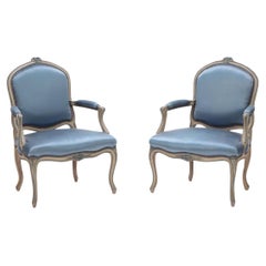 Pair of French Louis XV style open armchairs having carved frames circa 1920.