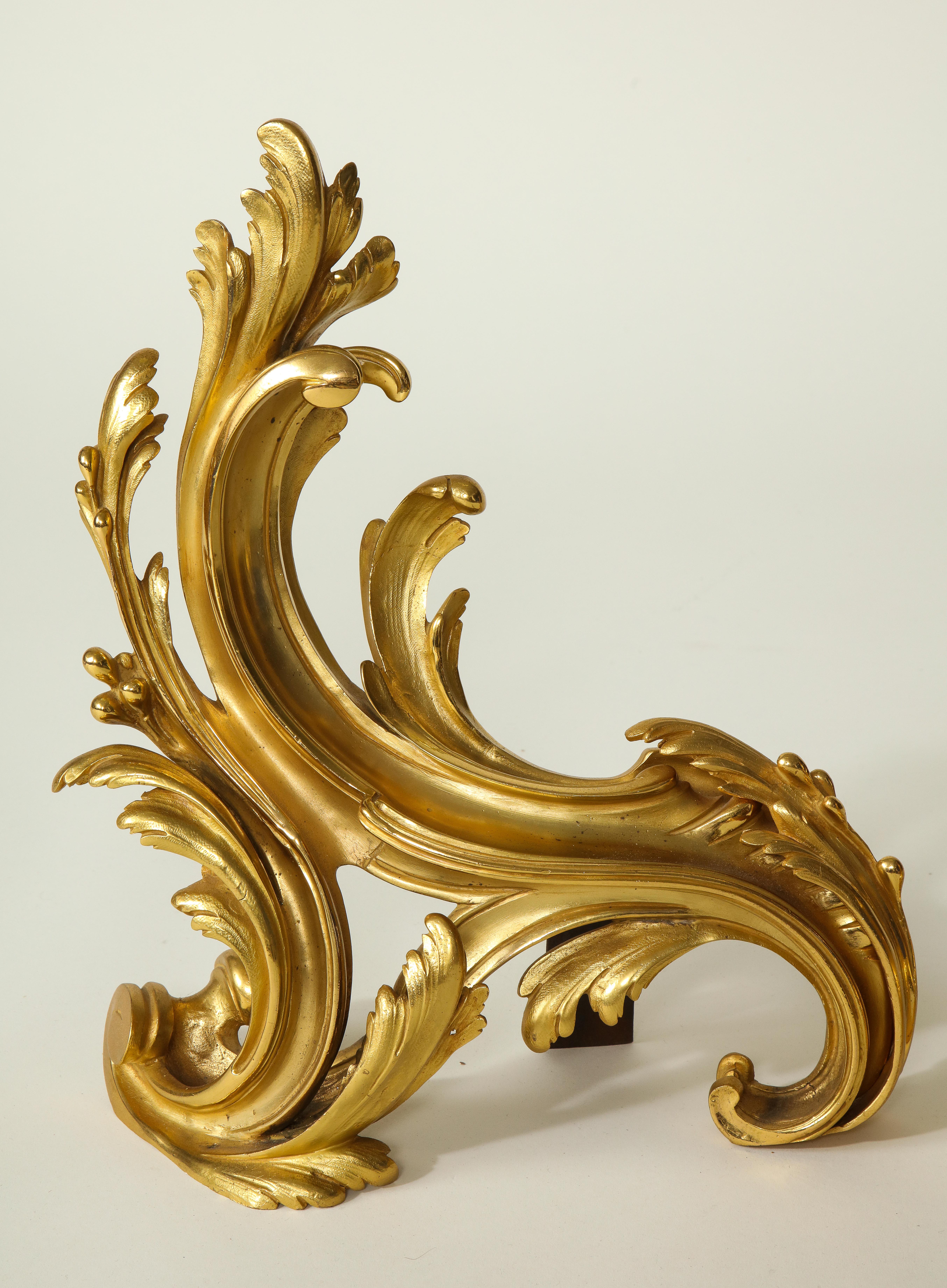 Each finely modeled in the form of acanthus leaf sprays.