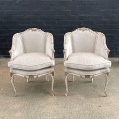 Pair of French Louis XV style Painted and Parcel-Gilt Armchairs