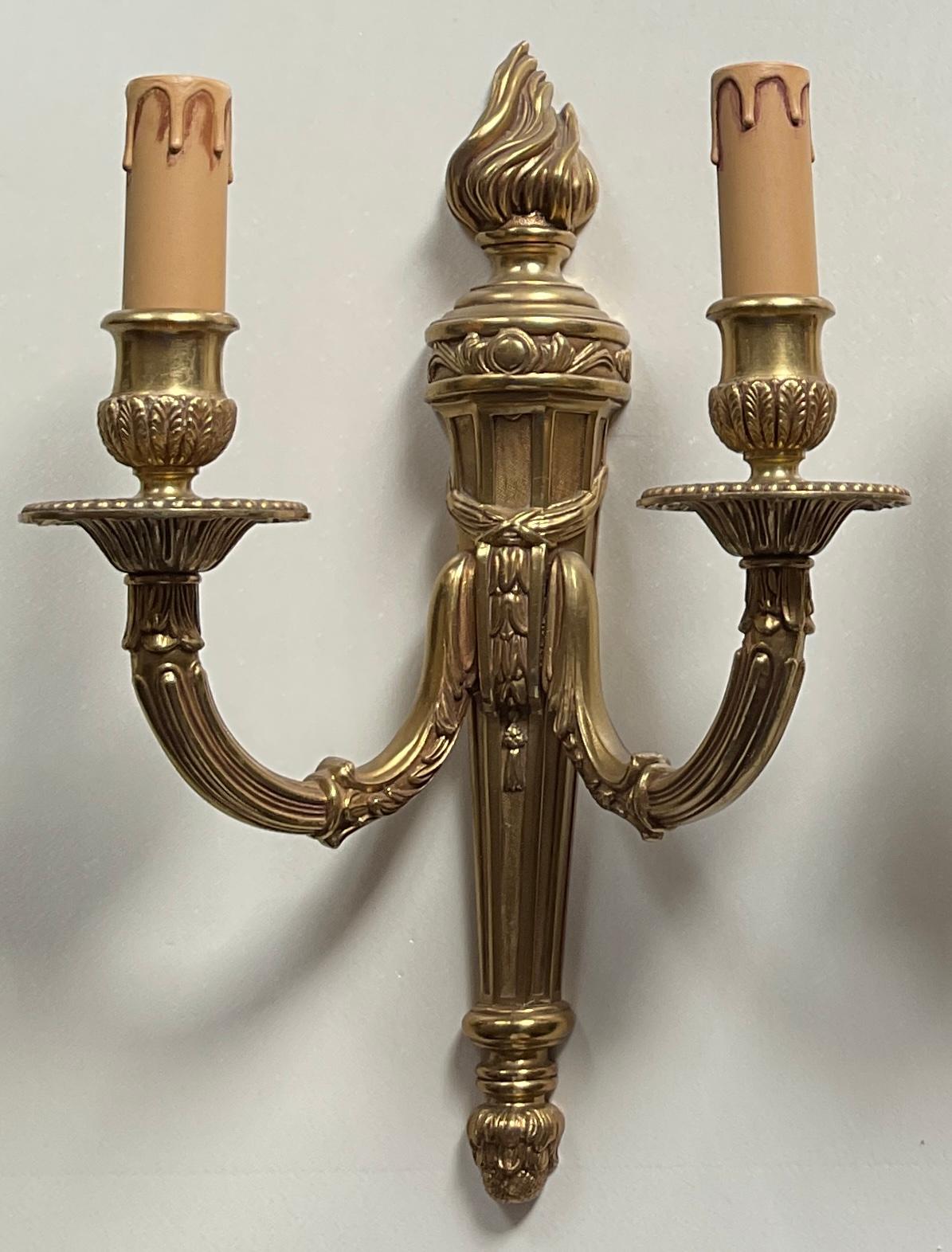 A Fine pair of French Louis XV style gilt bronze wall sconces. 

Beautiful designed and in very good condition.
Electrified.

Dimensions: 13 5/8