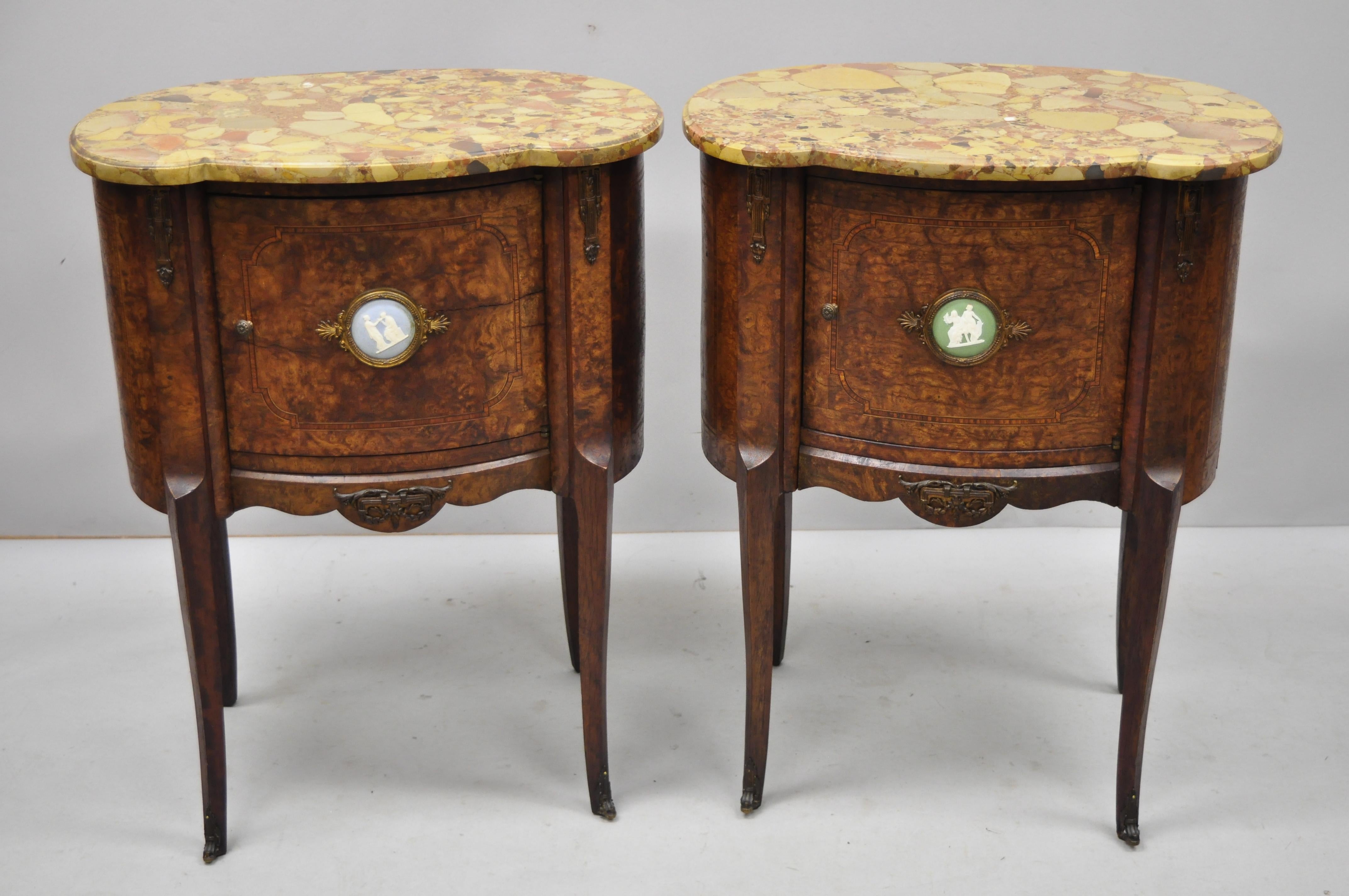 Pair of French Louis XV style rogue marble-top burl wood bombe nightstands. Listing includes shaped rogue marble tops, green and blue bisque porcelain medallions to door fronts, bronze ormolu, beautiful wood veneers, finished back, cabriole legs,