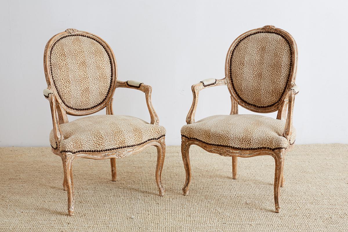 Hand-Carved Pair of French Louis XV Style Upholstered Fauteuils