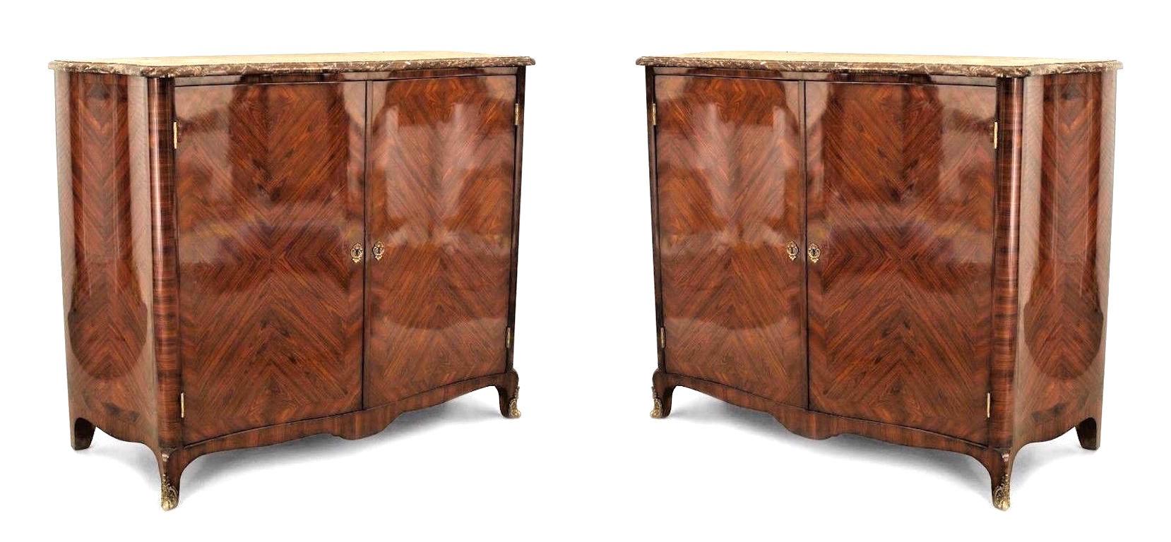 Pair of French Louis XV style (mid-19th Century) kingwood veneered serpentine shaped commodes with 2 front doors and a brown marble top with gilt bronze trim feet and escutcheons (PRICED AS Pair).
