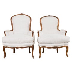Pair of French Louis XV Style Walnut Bergeres with Linen