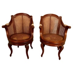 Vintage Pair of French Louis XV Style Walnut & Caned Swivel Armchairs