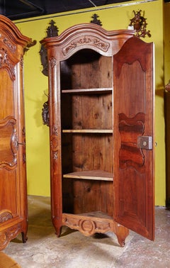 Pair of French Louis XV Walnut Corner Cabinets with 18th Century Carved Doors