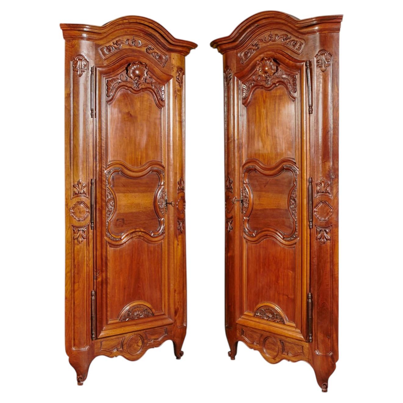 Pair of French Louis XV Style Walnut Corner Cabinets with 18th C. Carved Doors