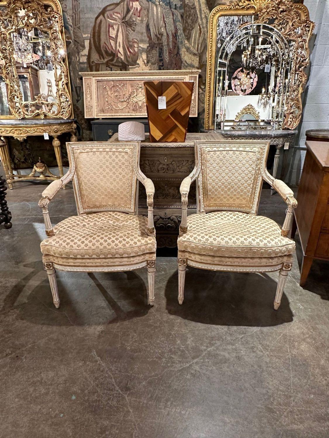 Pair of late 19th century French Louis XVI style carved and painted armchairs. circa 1890. Perfect for today's transitional designs!