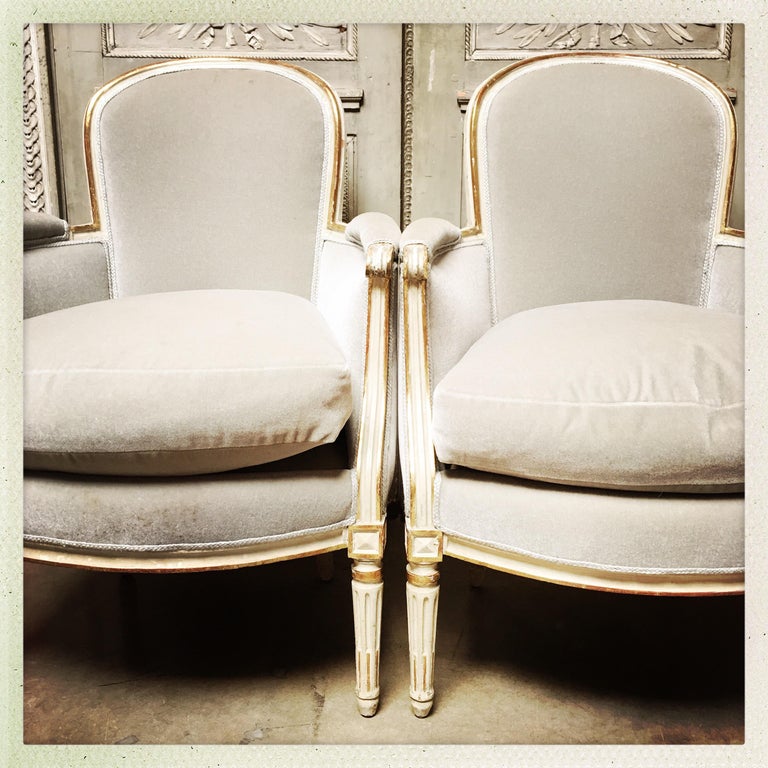 Pair of French Louis XVI Bergères with a Painted and Parcel Gilded Finish For Sale at 1stdibs