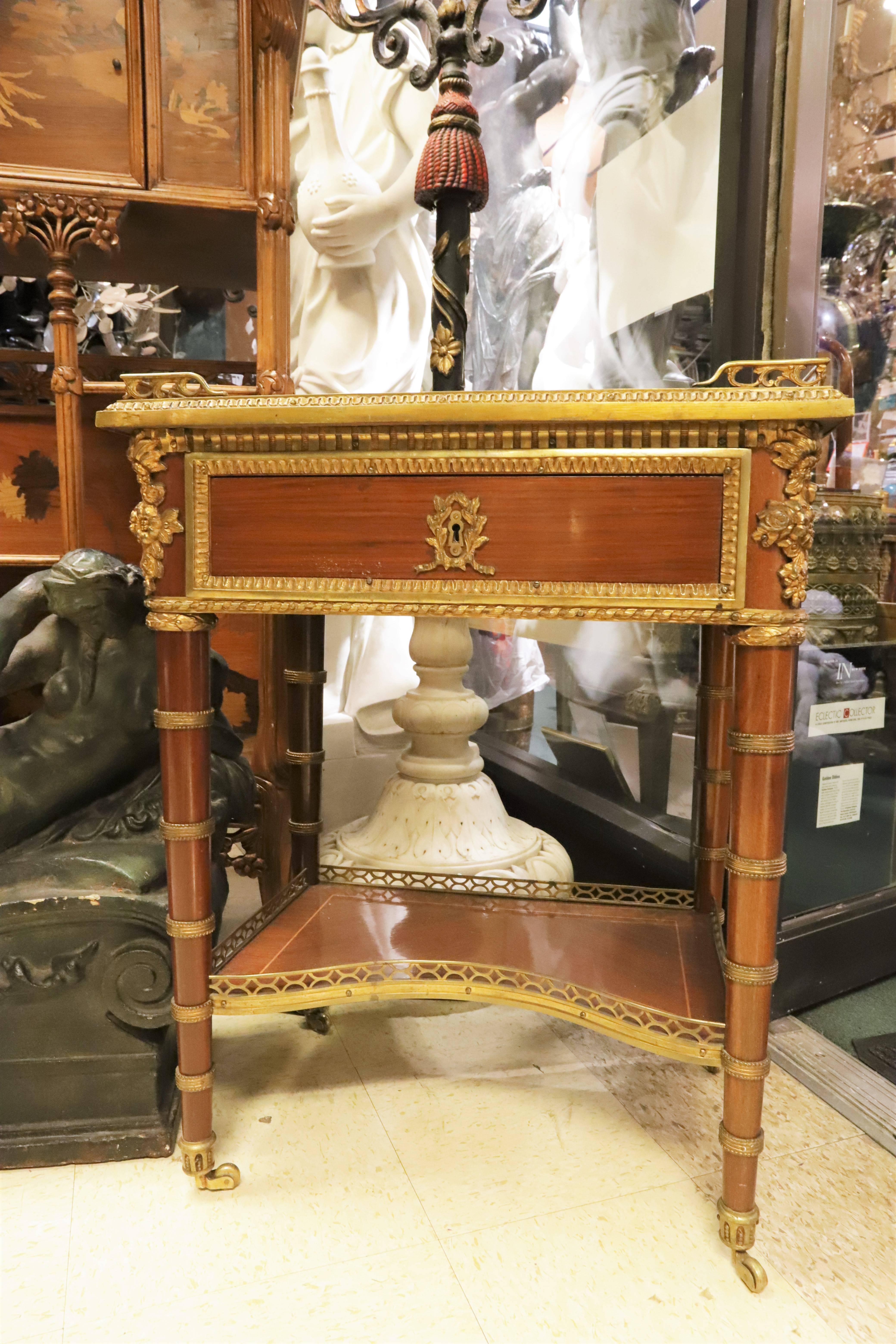 Pair of French Louis XVI bronze-mounted end tables; after modeled by Jean-Henri Riesener.