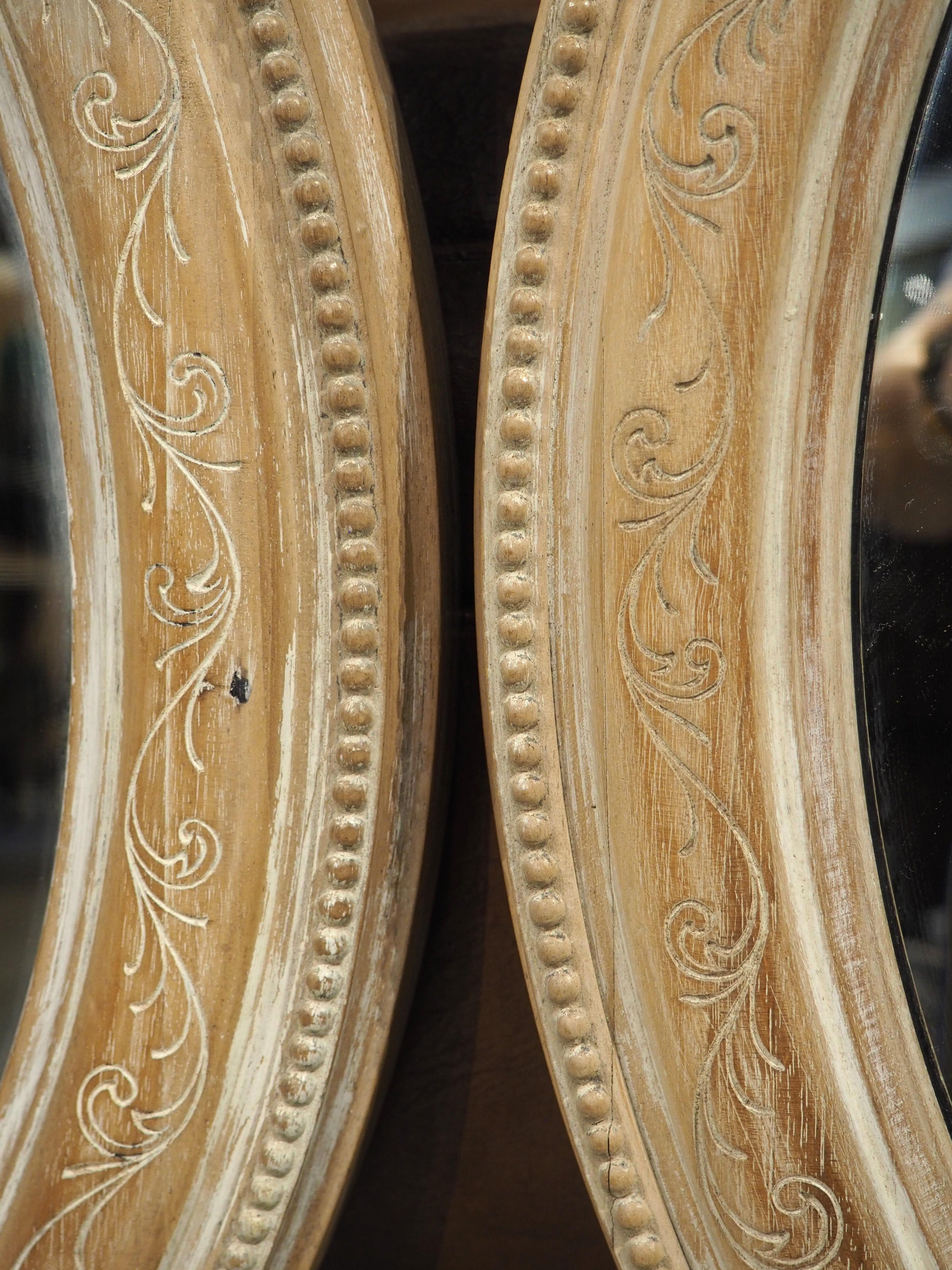 Pair of French Louis XVI Carved and Whitewashed Wooden Oval Mirrors, Early 1900s 5