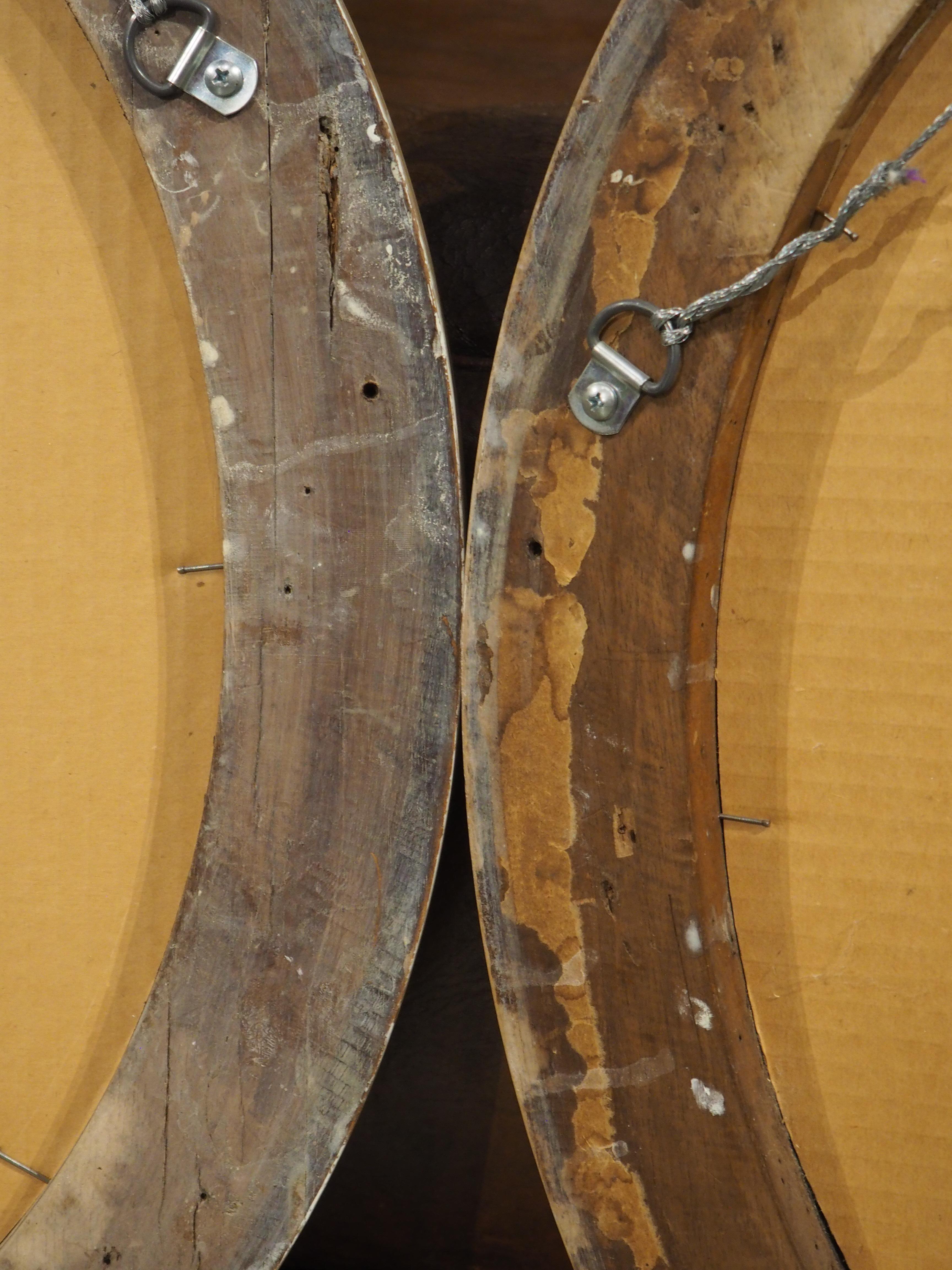 Hand-Carved Pair of French Louis XVI Carved and Whitewashed Wooden Oval Mirrors, Early 1900s