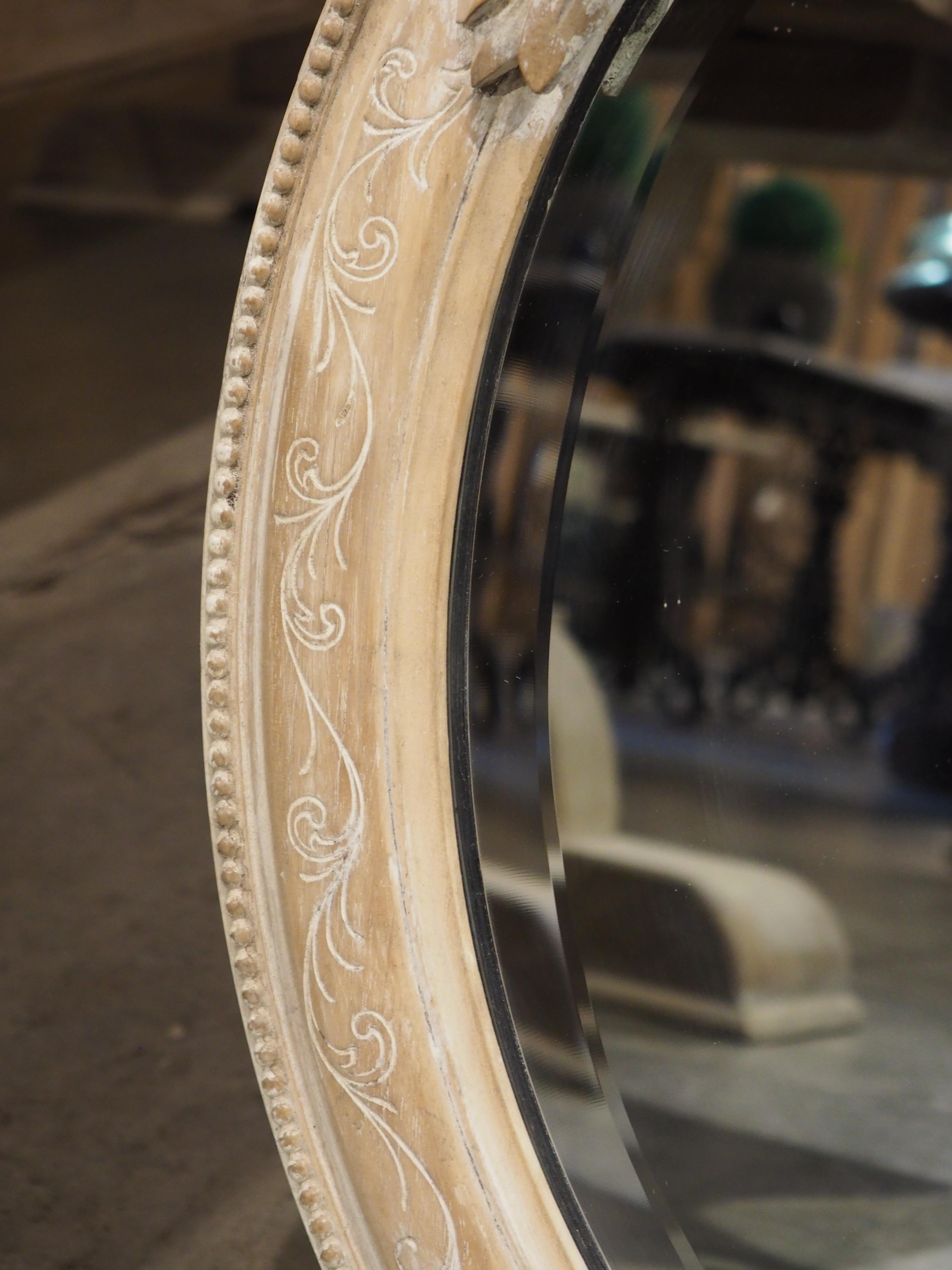 Pair of French Louis XVI Carved and Whitewashed Wooden Oval Mirrors, Early 1900s 1