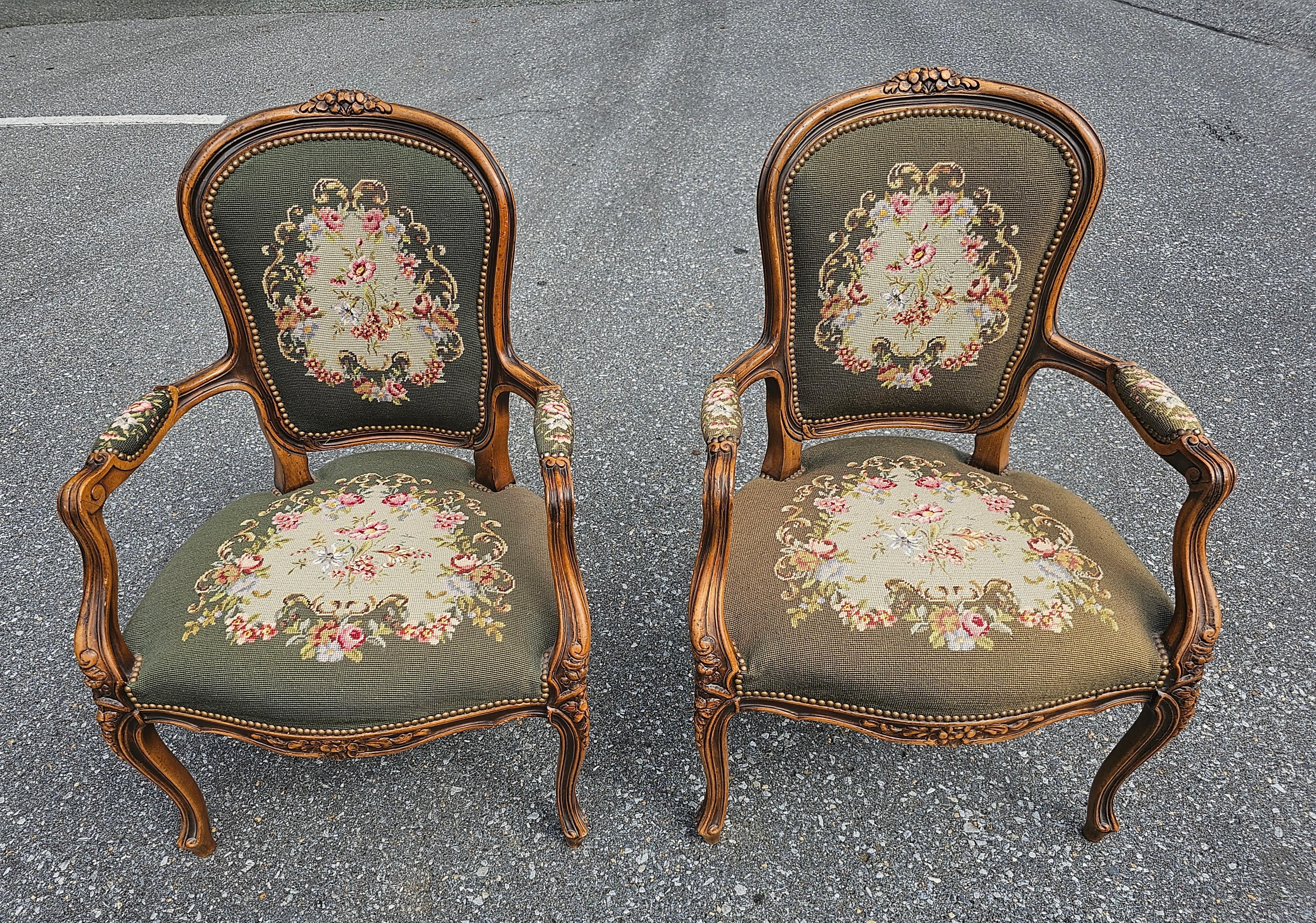 Pair of French Louis XVI Carved Fruitwood and Needlepoint Upholstered Bergeres In Good Condition For Sale In Germantown, MD