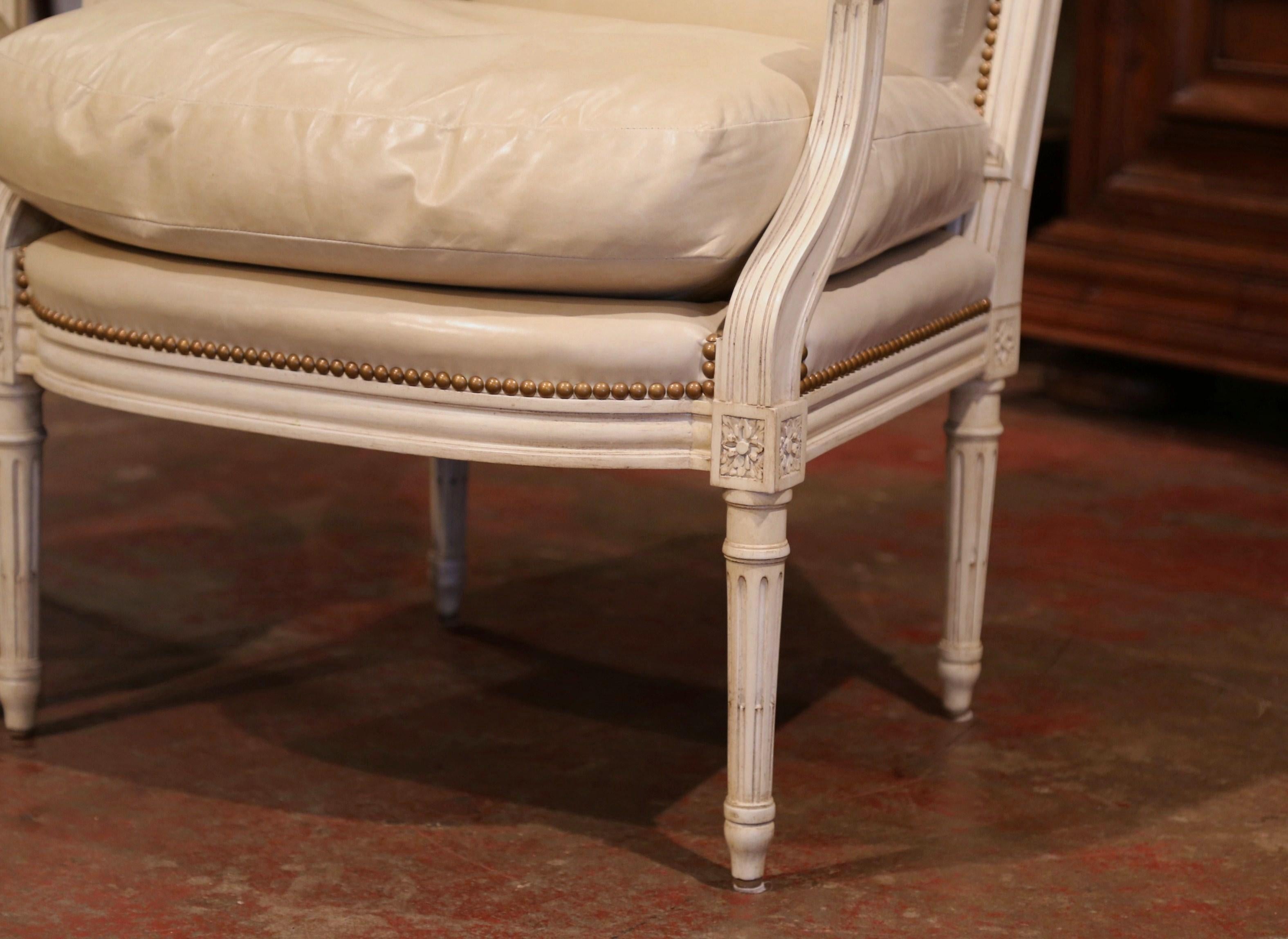 Pair of French Louis XVI Carved Painted Armchairs with Beige Leather Upholstery In Excellent Condition In Dallas, TX