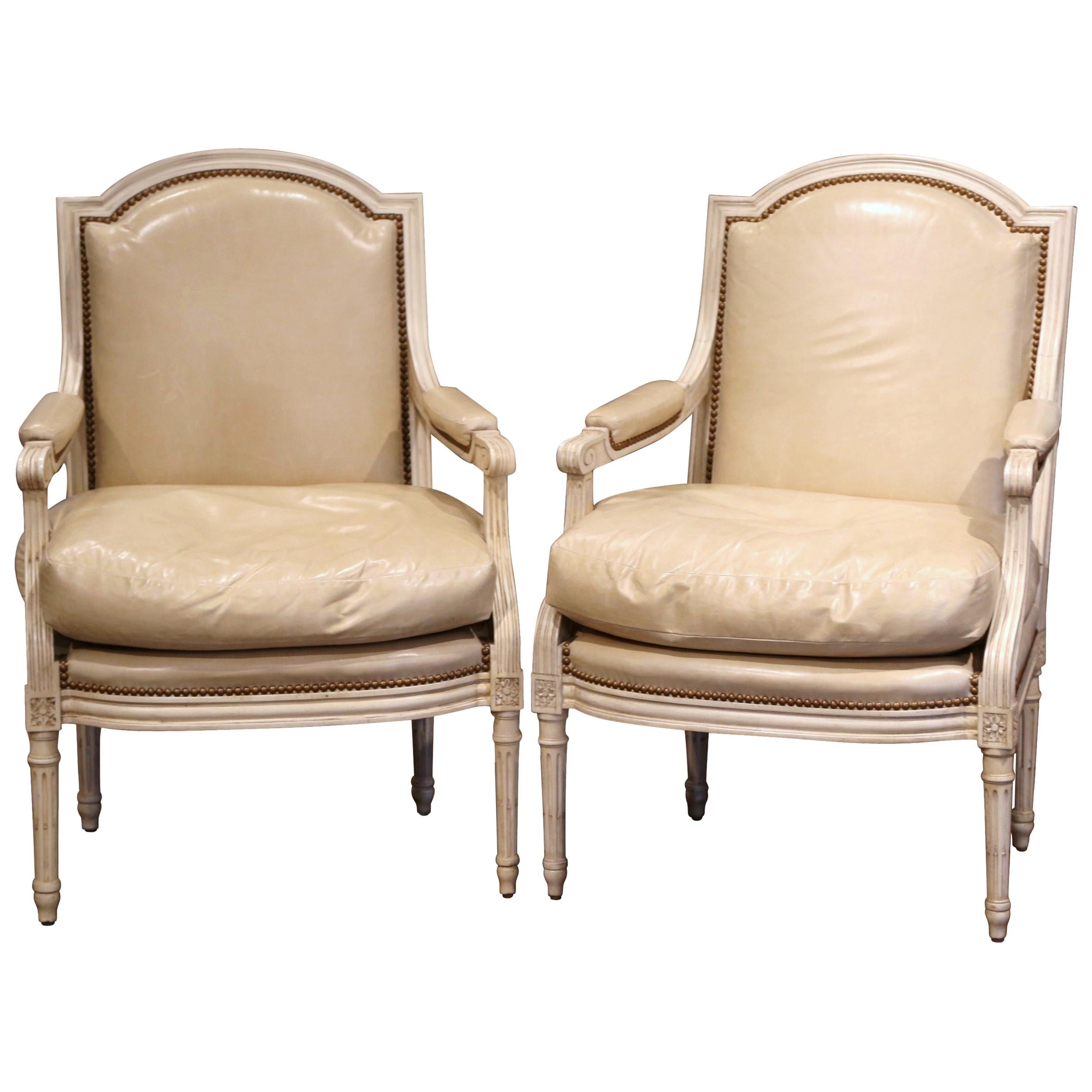 Pair of French Louis XVI Carved Painted Armchairs with Beige Leather Upholstery