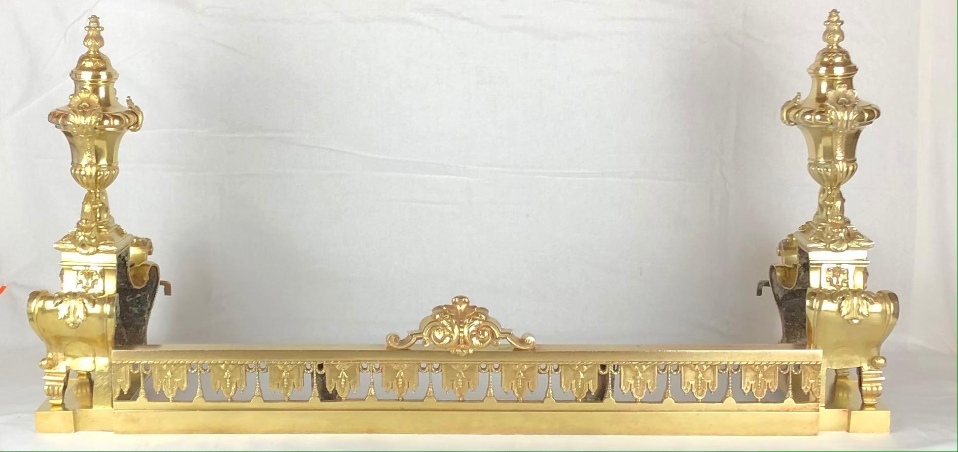 Exquisite French Louis XVI gilded bronze andirons or chenets with centered urn having festoons (flowers, foliage and fruit) through each side with a flame finial tops.

This pair of beautifully crafted chenets, retain their original gilding which