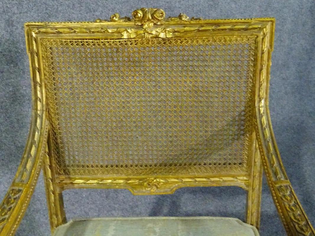 Early 20th Century Pair of French Louis XVI Gilded Caned Armchairs Armchairs Fauteuils, circa 1920s
