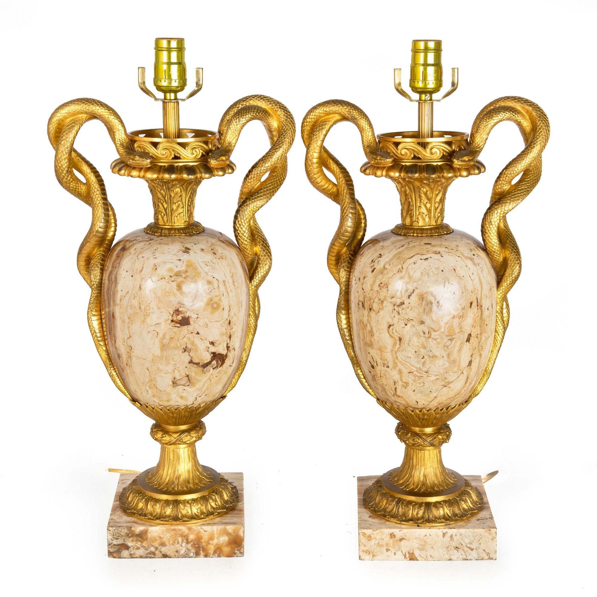 AN EXCEEDINGLY FINE PAIR OF LOUIS XVI STYLE VASIFORM LAMPS WITH ONYX SURMOUNTED BY INTRICATELY CAST GILT-BRONZE ENTWINED SNAKE HANDLES
France, circa 1870
Item # 307JUX13W 

A truly stunning pair of vasiform lamps in the Louis XVI taste, they feature