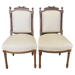 Pair of French Louis XVI Intricately Carved Walnut Side Chairs, New Upholstery