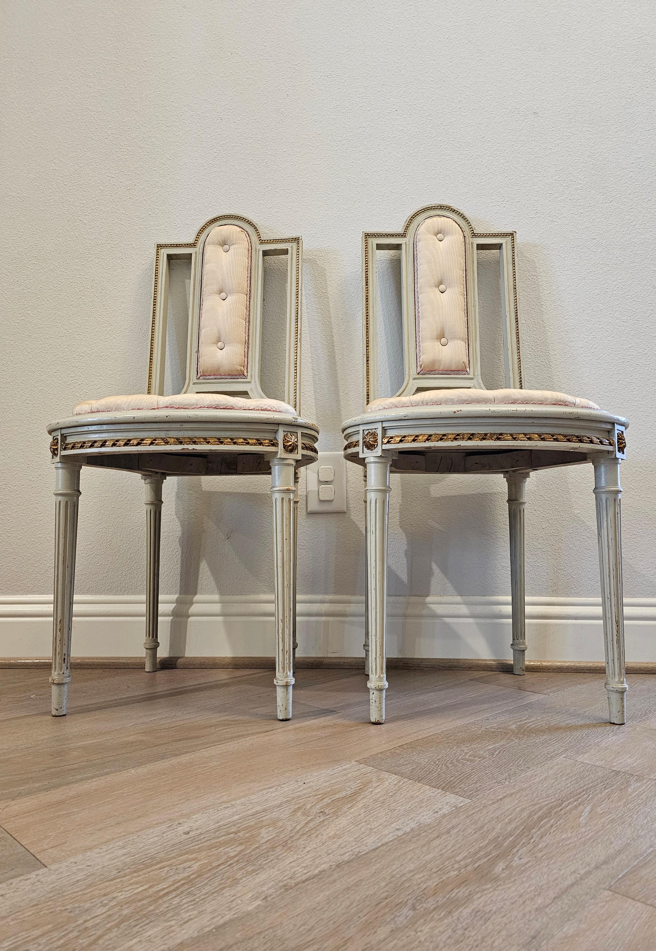 Upholstery Pair of French Louis XVI Painted Parcel Gilt Petite Antique Chairs For Sale