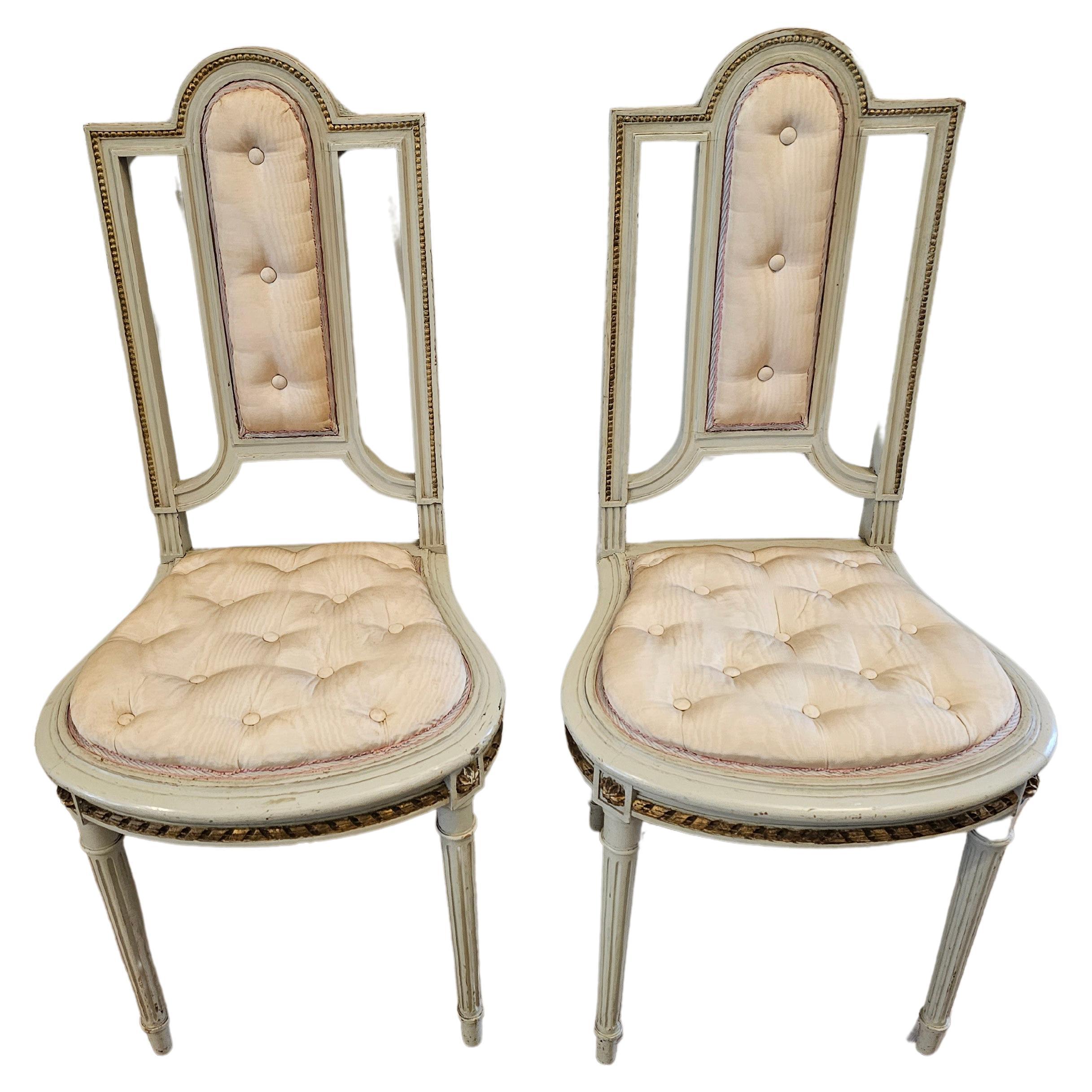 Pair of French Louis XVI Painted Parcel Gilt Petite Antique Chairs For Sale