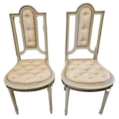 Pair of French Louis XVI Painted Parcel Gilt Antique Chairs