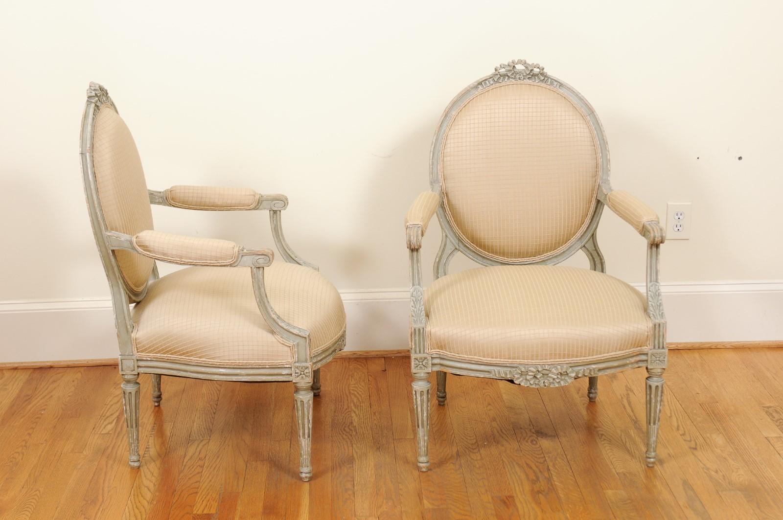 19th Century Pair of French Louis XVI Style 1850s Oval Back Armchairs with Carved Ribbons