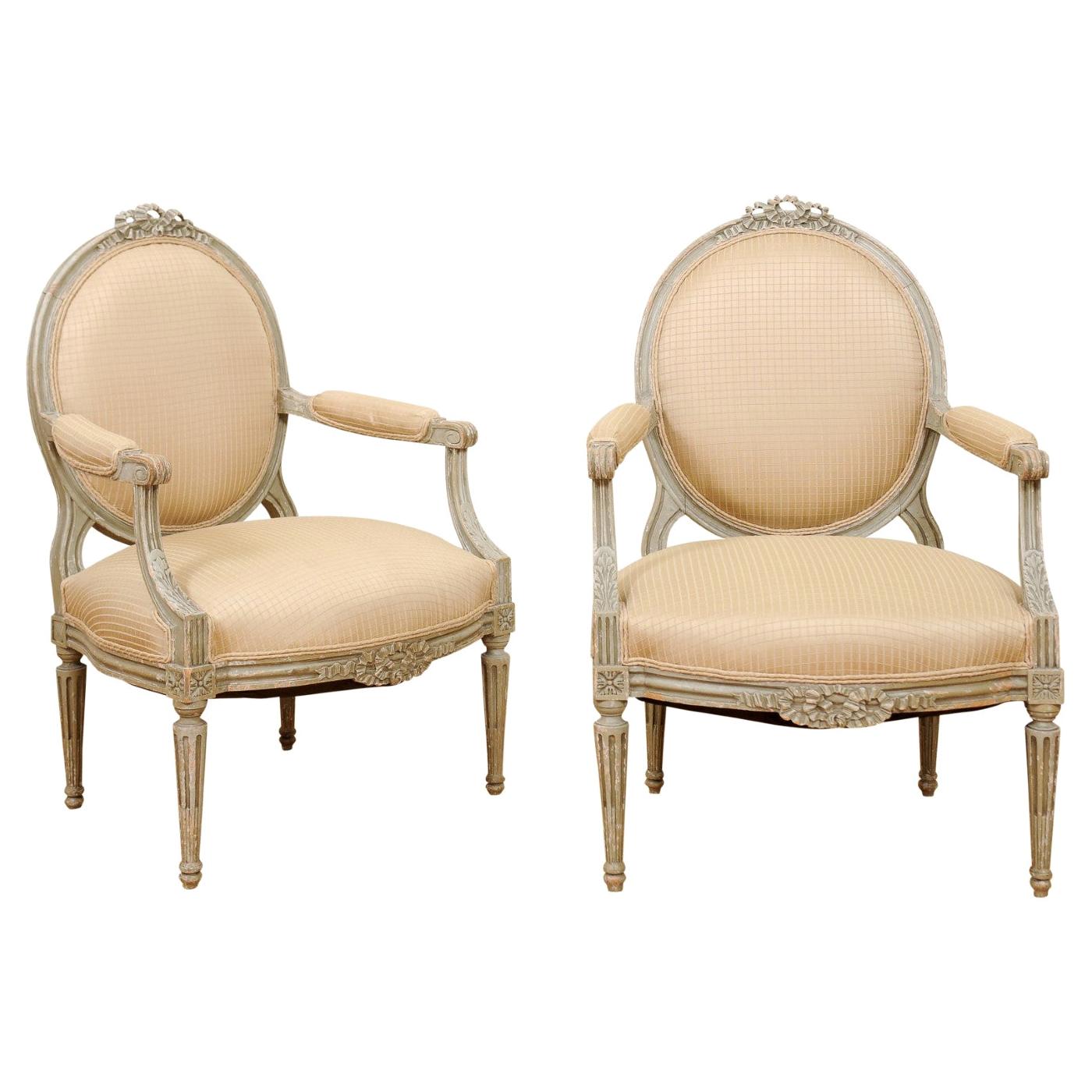 Pair of French Louis XVI Style 1850s Oval Back Armchairs with Carved Ribbons