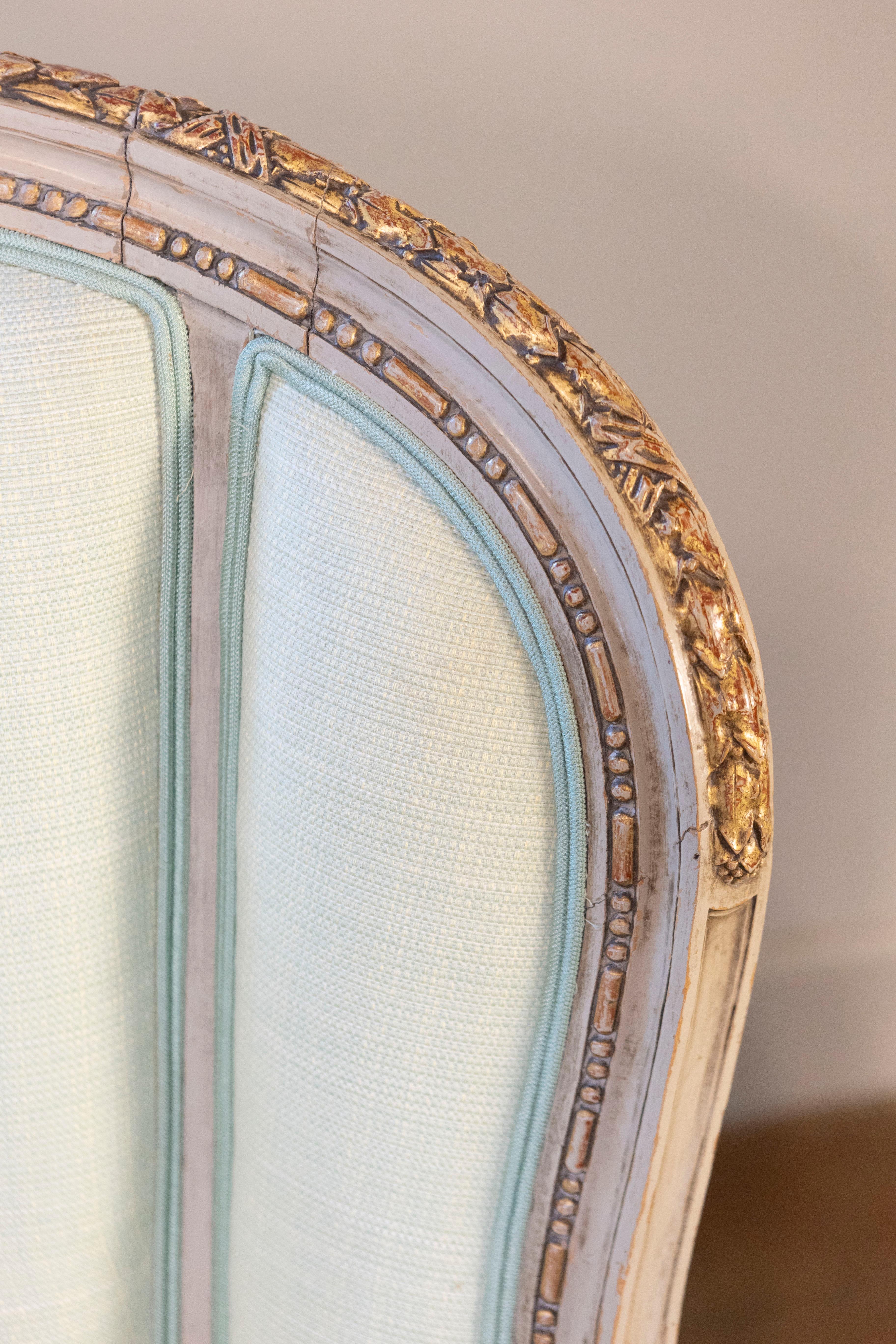 Pair of French Louis XVI Style 1900s Painted and Parcel-Gilt Bergères Chairs In Good Condition For Sale In Atlanta, GA