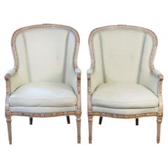Pair of French Louis XVI Style 1900s Painted and Parcel-Gilt Bergères Chairs