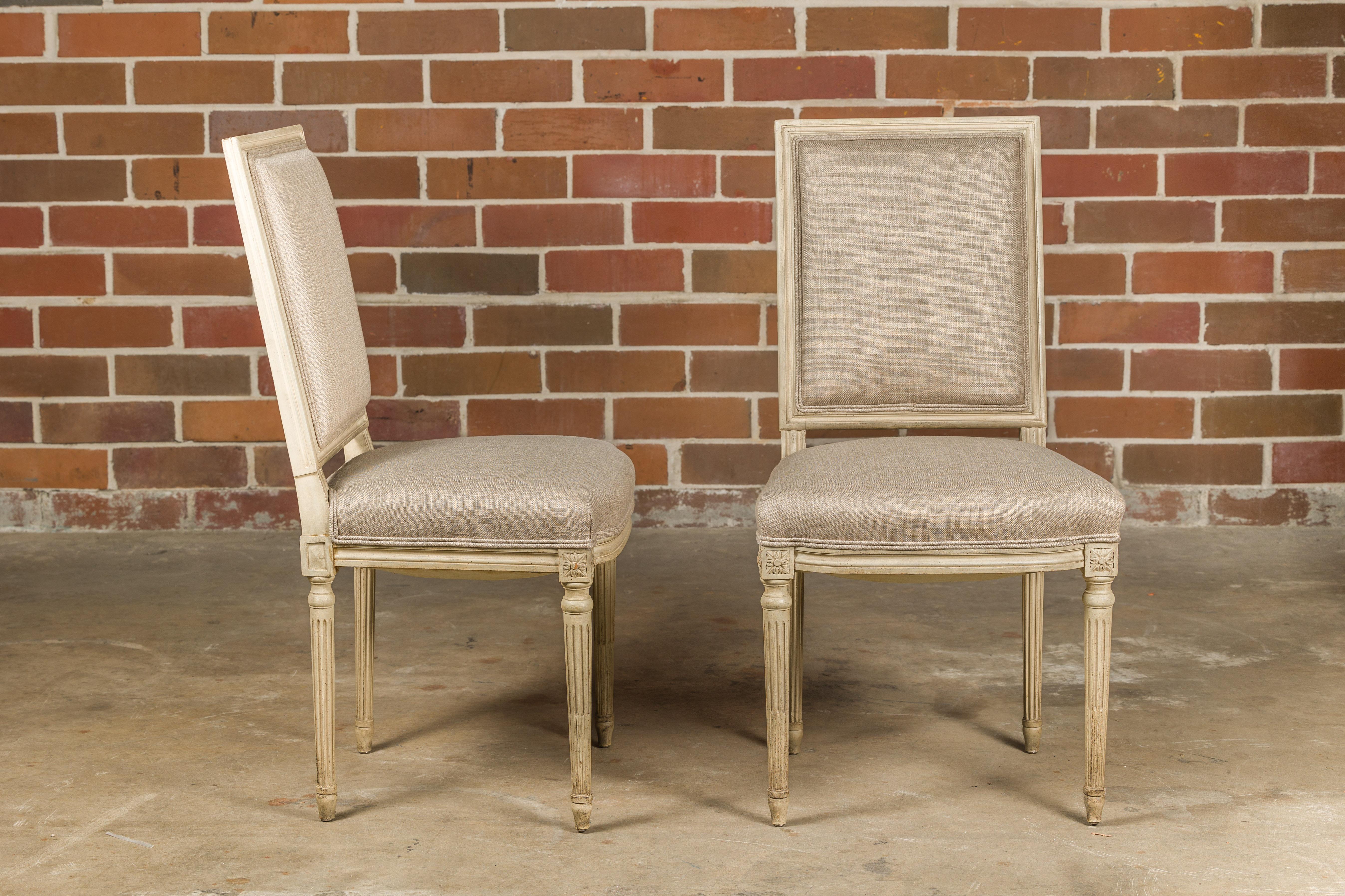 Carved Pair of French Louis XVI Style 1920s Painted Side Chairs with Fluted Legs  For Sale