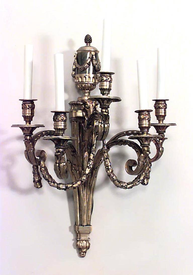 Pair of French Louis XVI-style (19/20th Century) bronze dore wall sconces with five arms, festoon design, and finial tops with ram heads (PRICED AS Pair)

