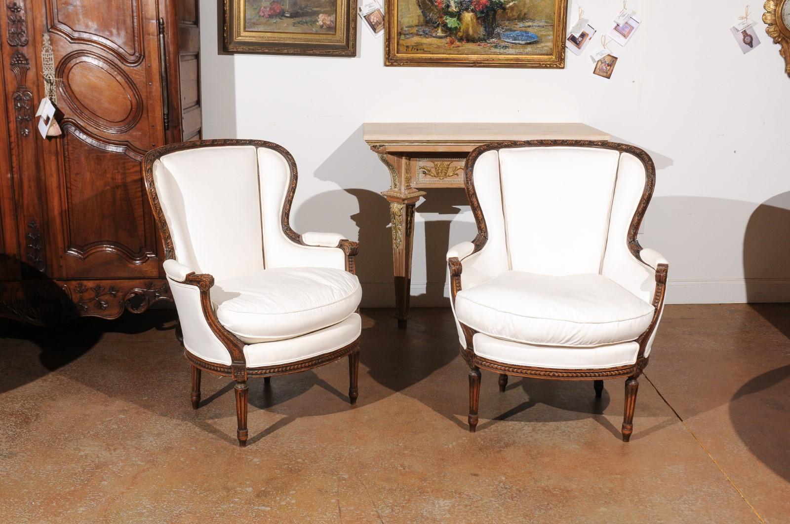 Pair of French Louis XVI Style 19th Century Upholstered Wingback Bergère Chairs In Good Condition In Atlanta, GA