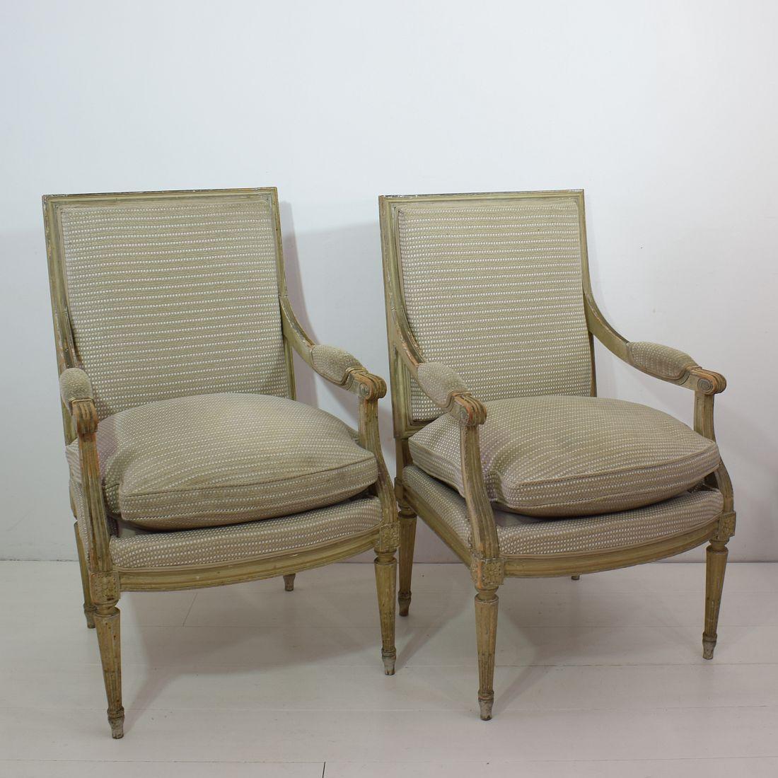 Beautiful pair of Louis XVI style armchairs, France, circa 1940, in beautiful weathered but structural good condition. They need new lining. 
Measure: Seat height is 47 cm. More pictures available on request.