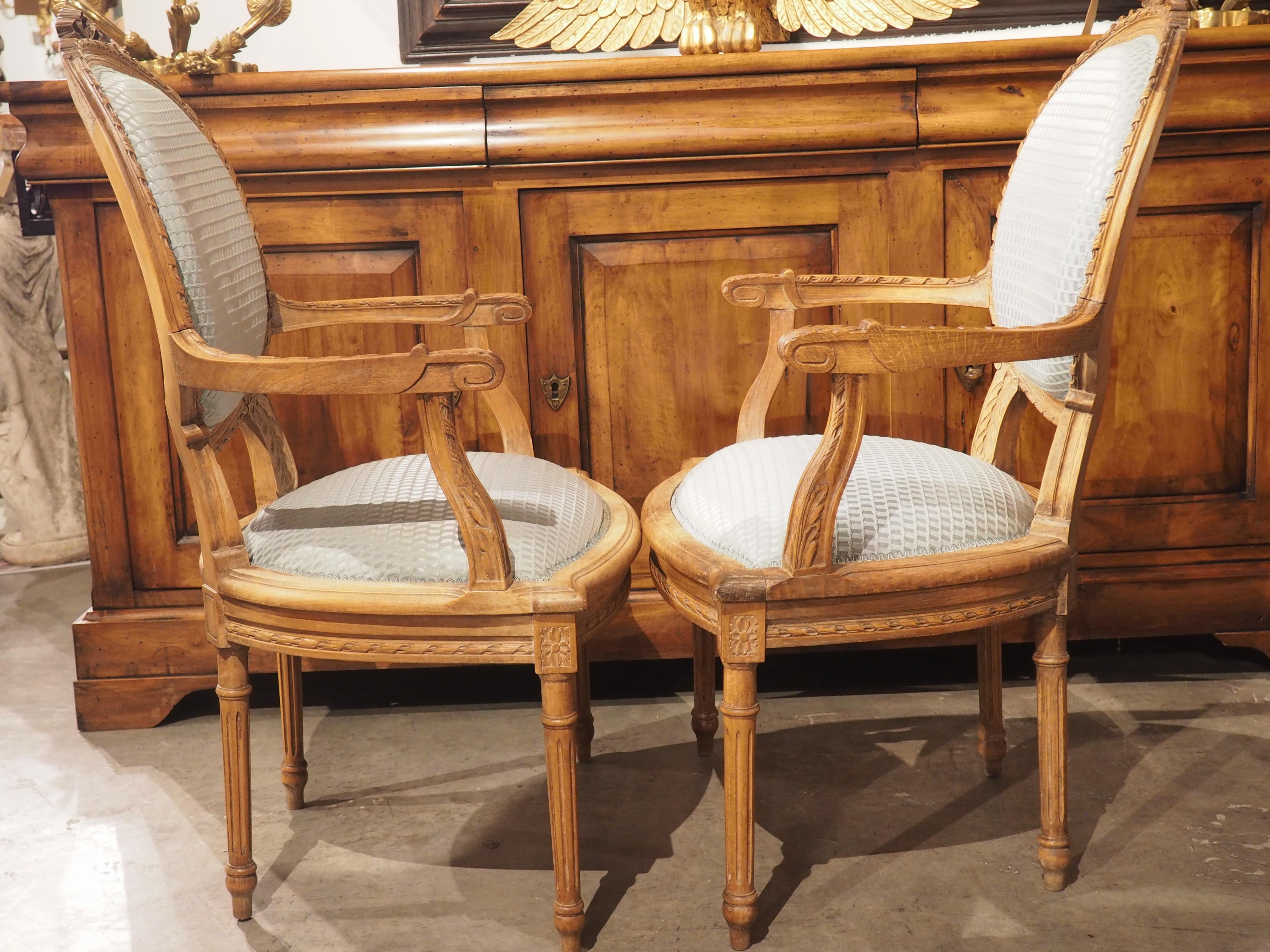 Pair of French Louis XVI Style Beechwood and Blue Silk Cabriolet Armchairs For Sale 6